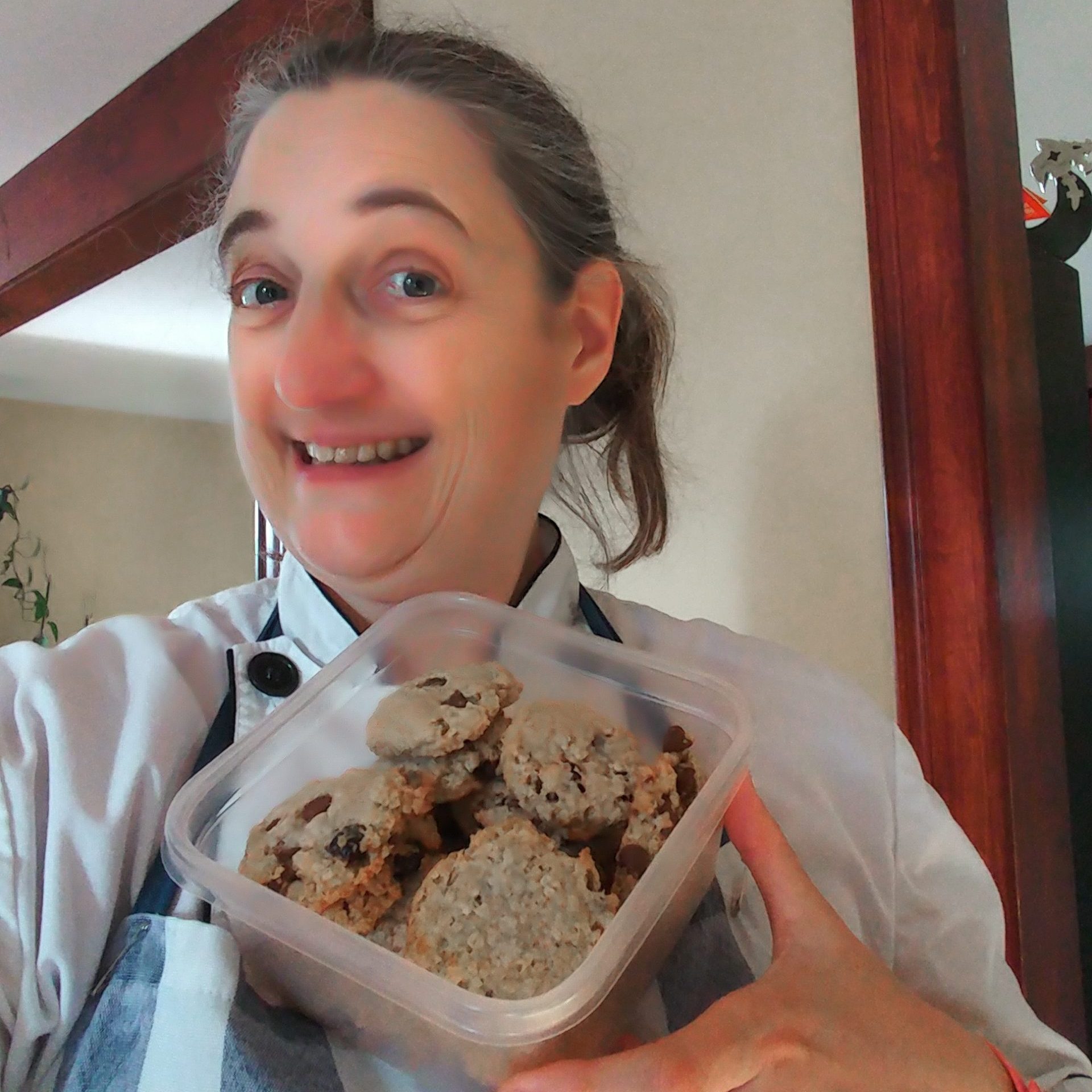 Stephie is showing a batch of cookies she just made.
