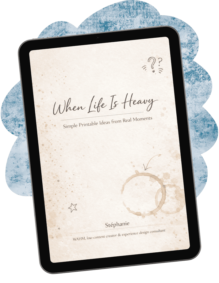When Life Is Heavy Simple Mockup A tablet displays the cover of an ebook titled "When Life Is Heavy: Simple Printable Ideas from Real Moments" by Stéphanie, featuring coffee stains and a minimalist design.